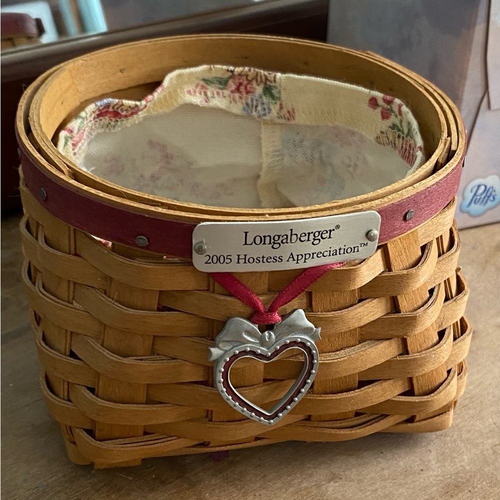 Longaberger Tan Basket with Red Trim and Heart Charm. Small about five inches.